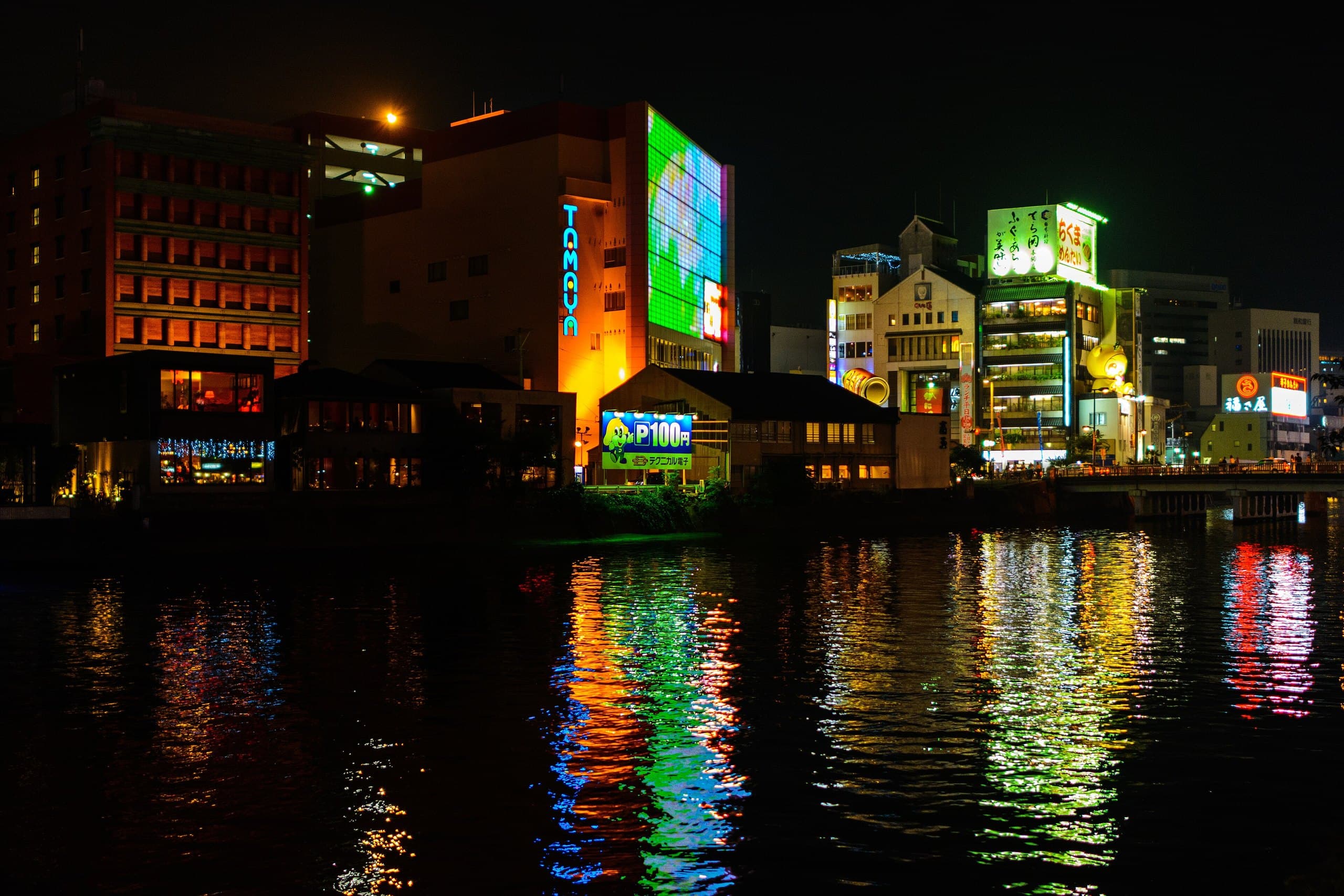 Neon lights of Nakasu reflected in the Naka River at night