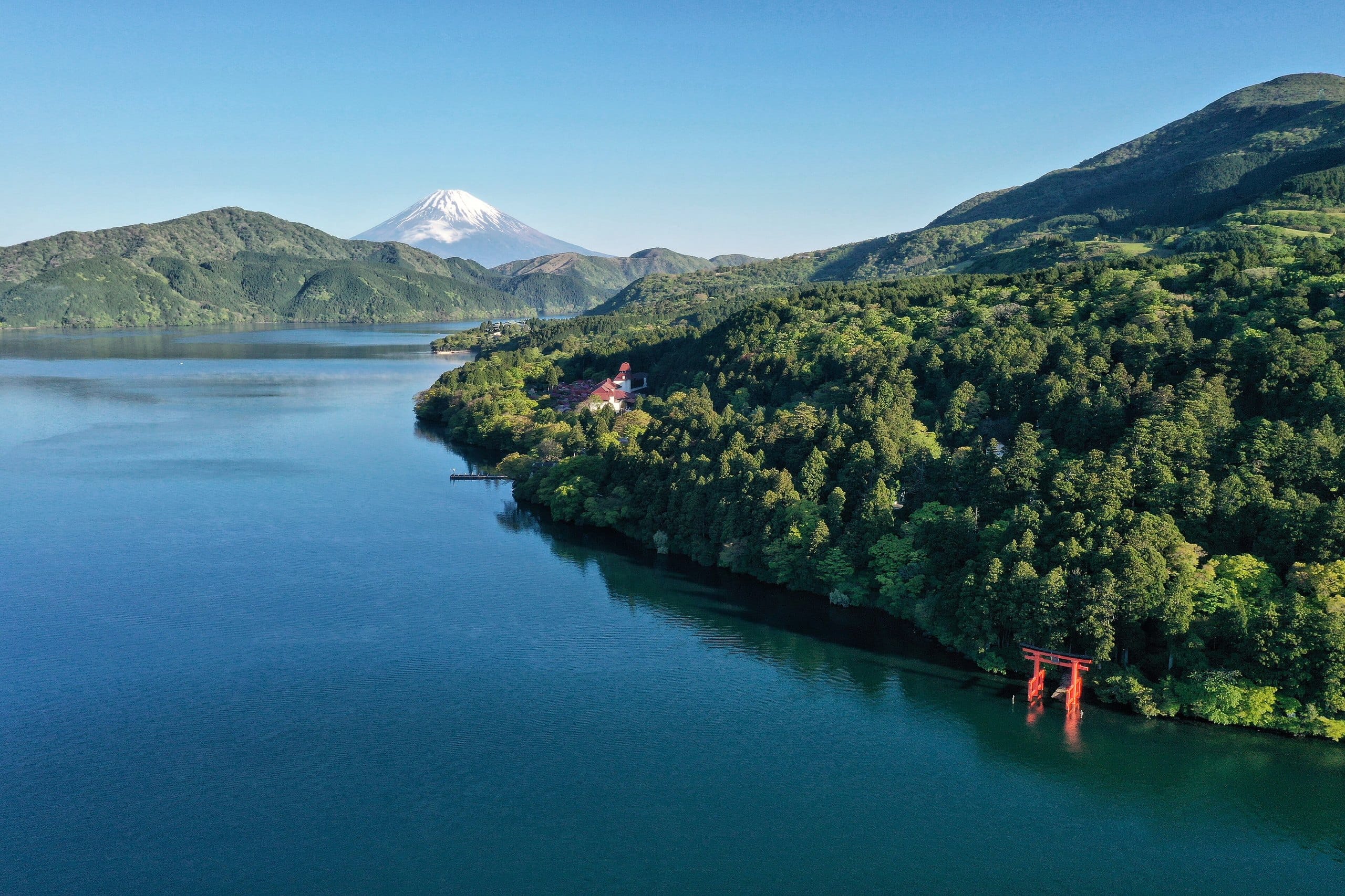 Lake Ashi with Mount Fuji and the red lakeside torii of Hakone Shrine