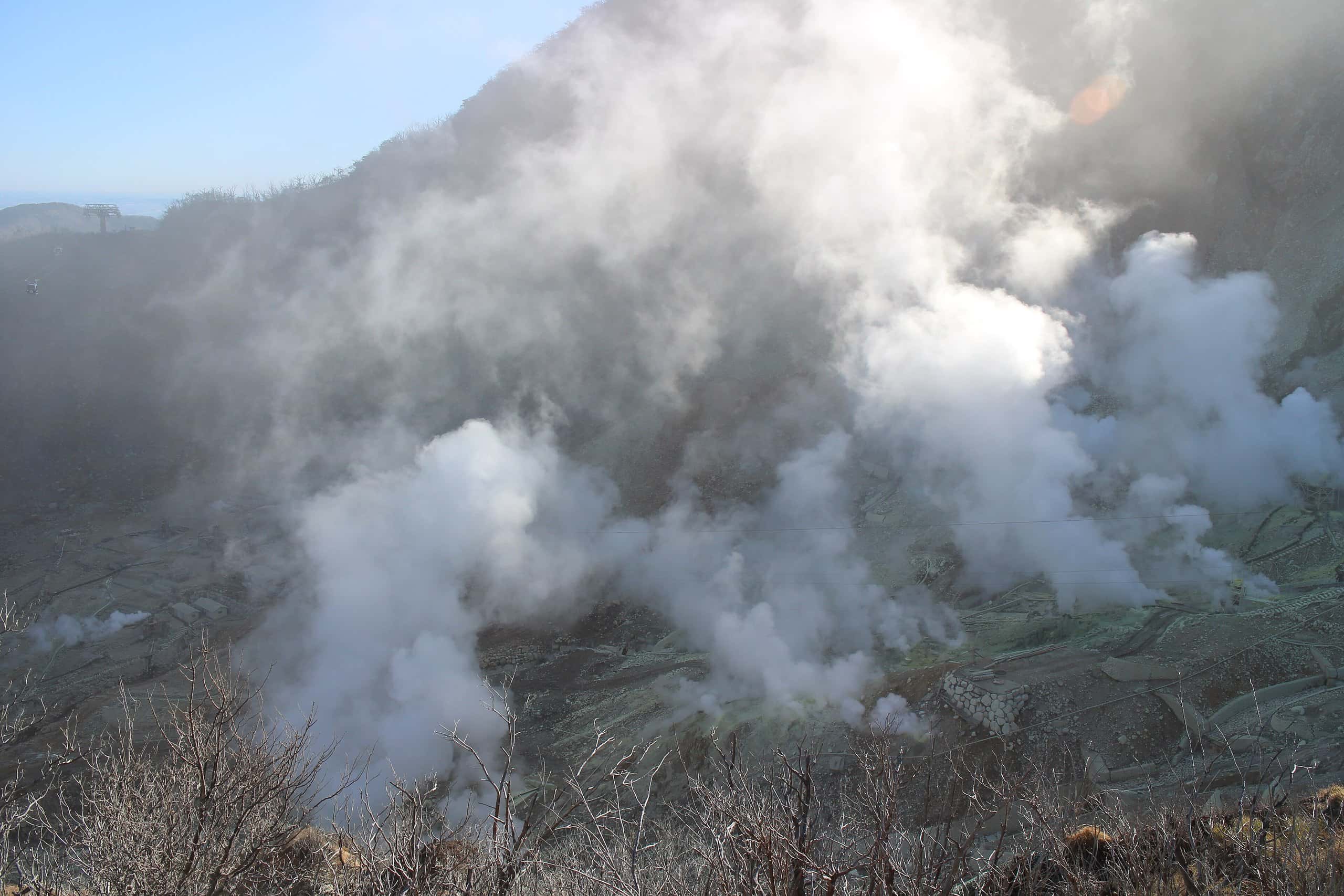Volcanic steam vents rising across the Owakudani valley