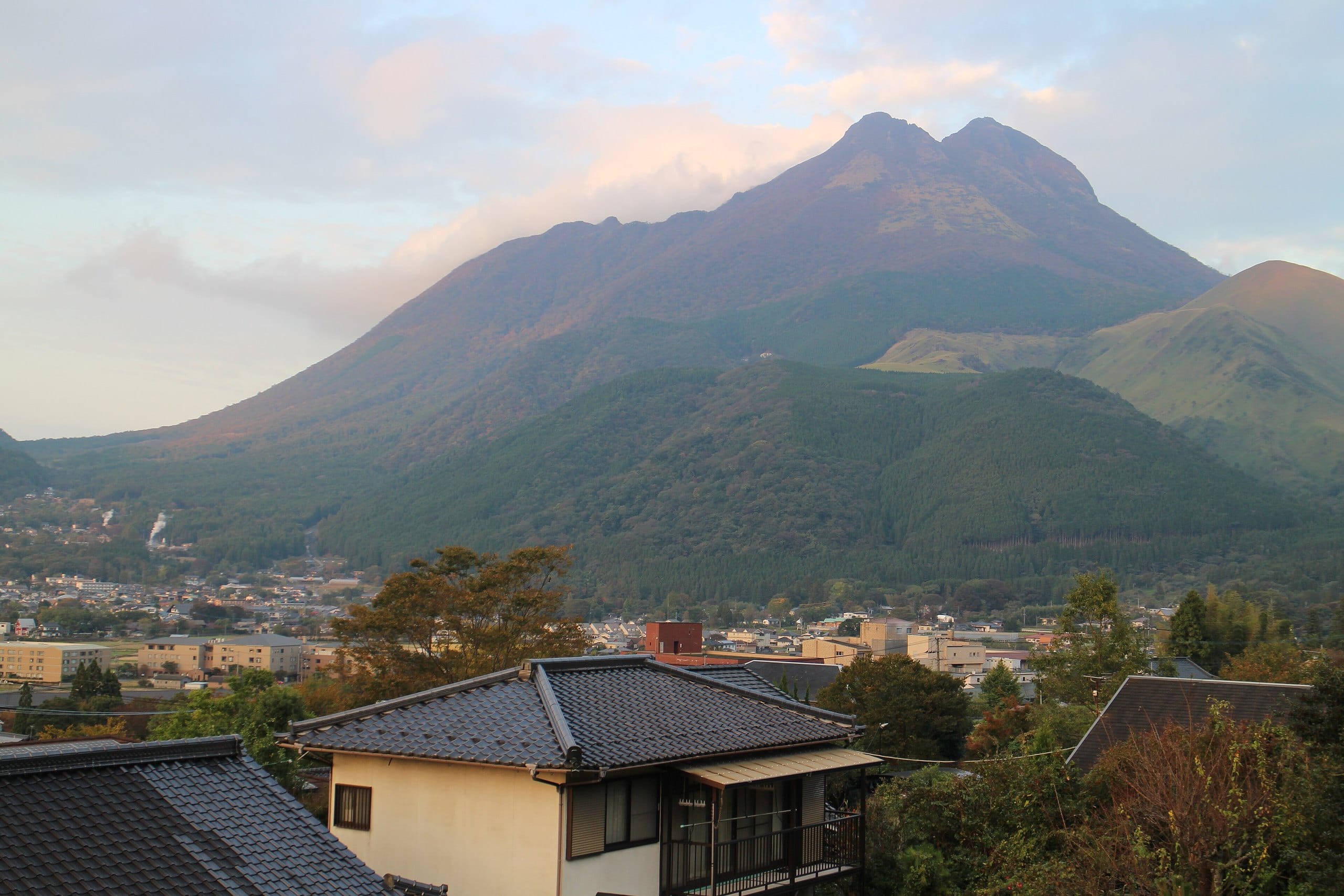 Twin peaks of Mount Yufu above the Yufuin town at sunrise