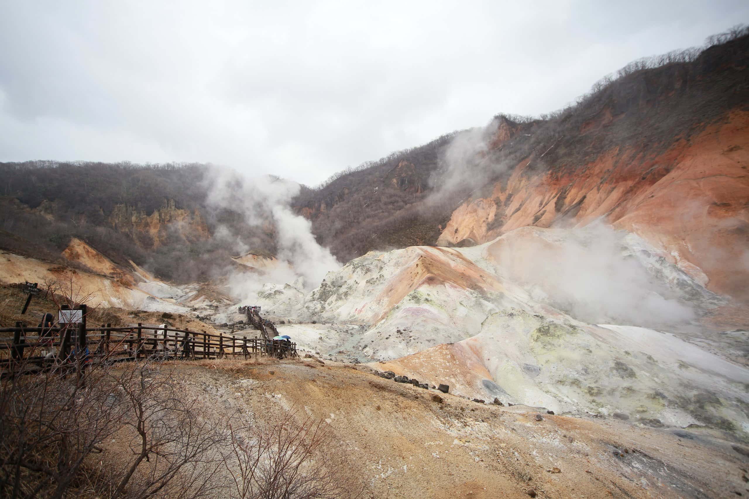 Steam rising over the barren volcanic valley of Jigokudani, Noboribetsu