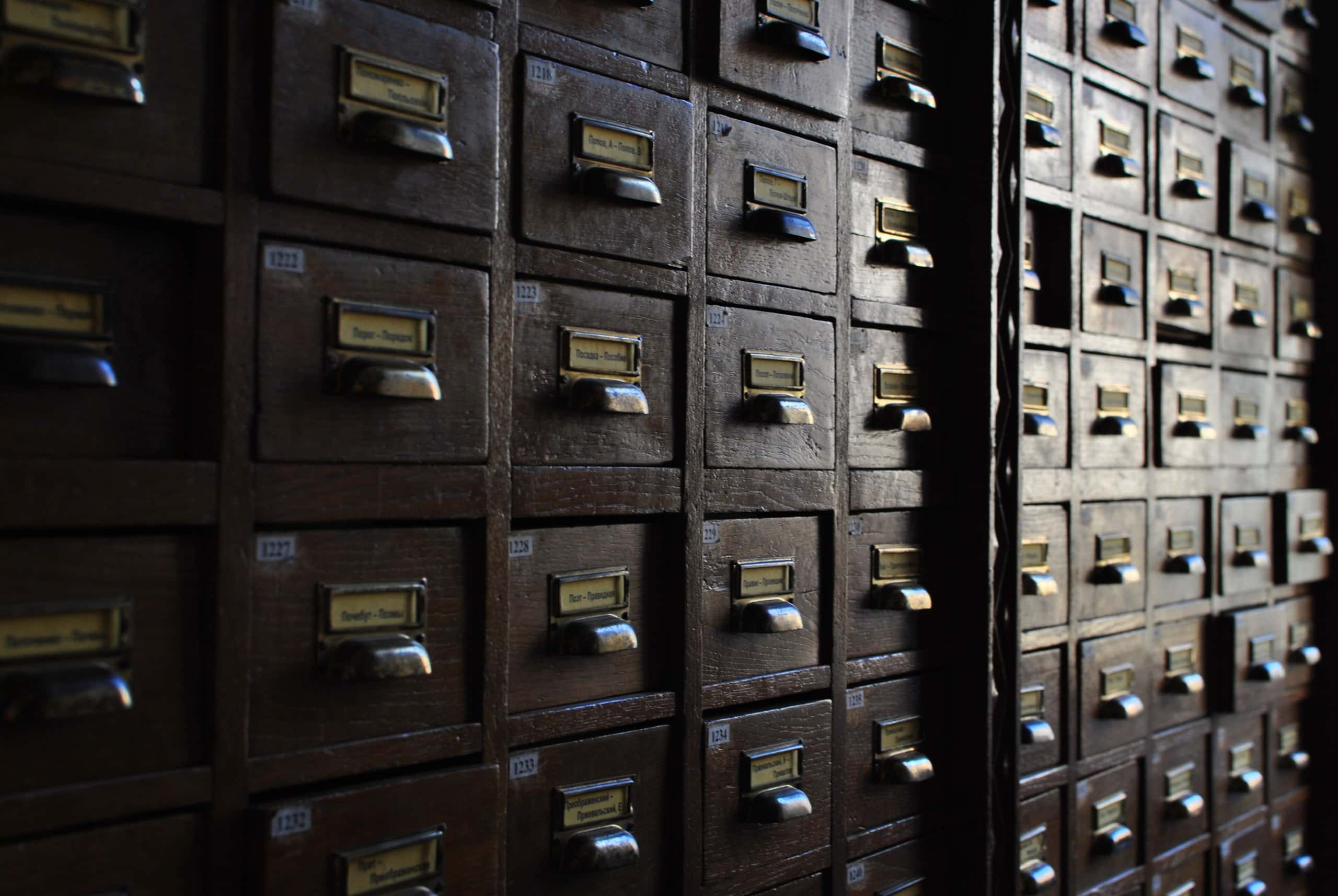 Rows of small dark wooden card-catalogue drawers